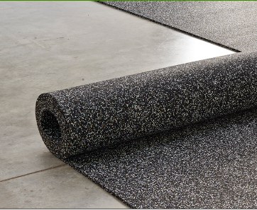 Unrolling a roll of 20% Gray and 80% Black Tire Veneer resilient flooring, 4 foot wide x 1/4 inch thick over a concrete floor.
